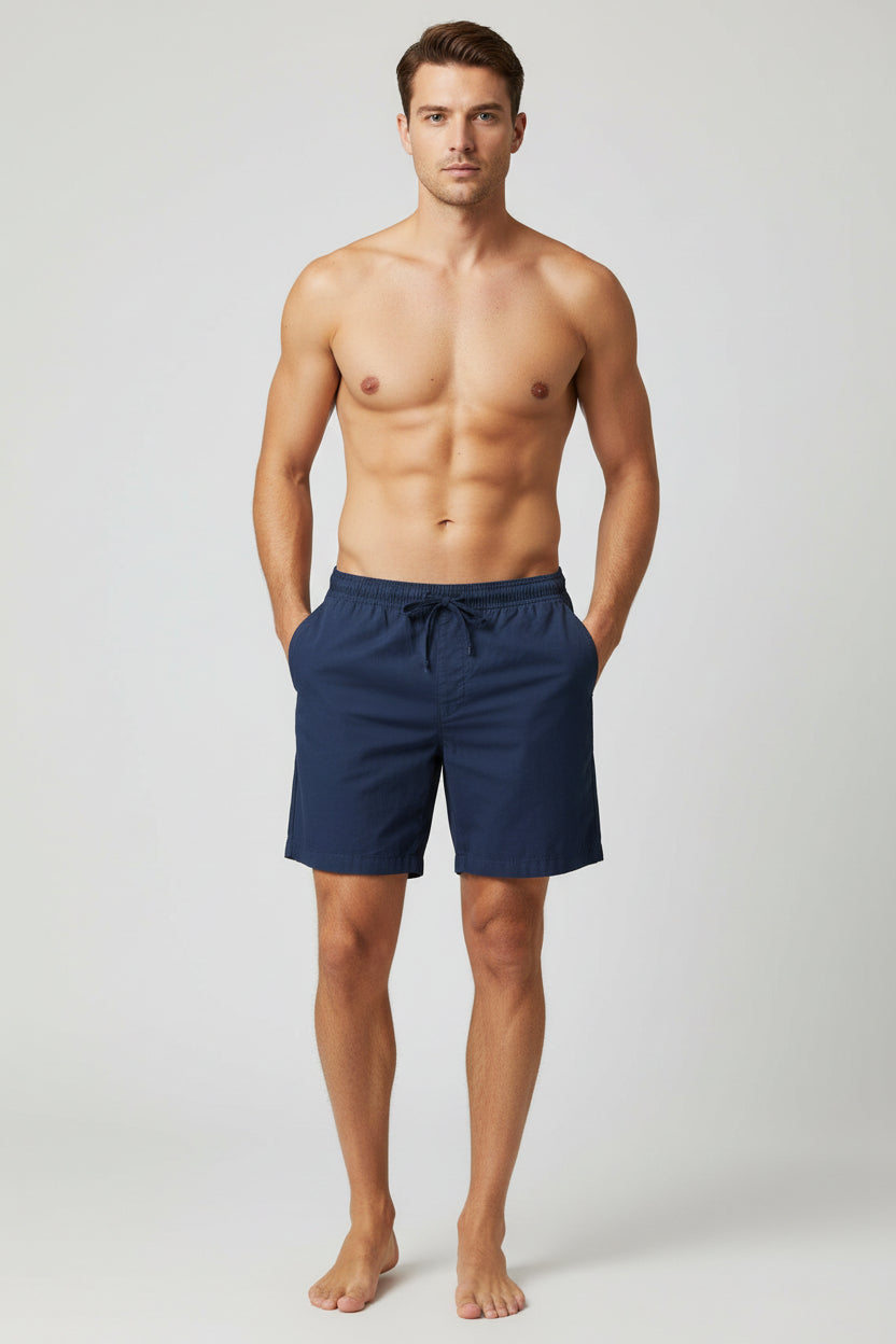 Navy blue shorts on a wooden table