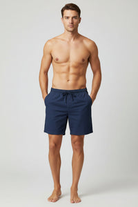 Navy blue shorts on a wooden table
