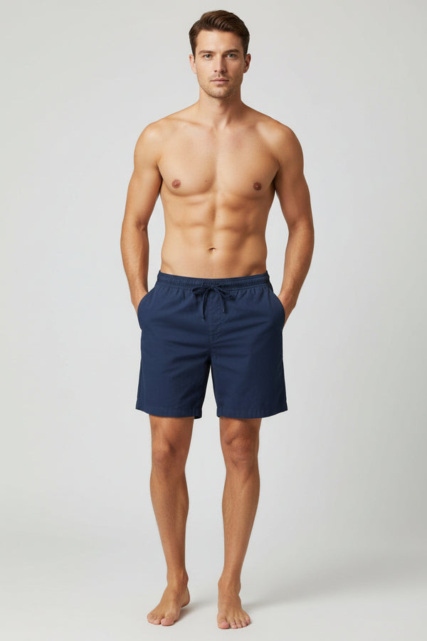 Navy blue shorts on a wooden table