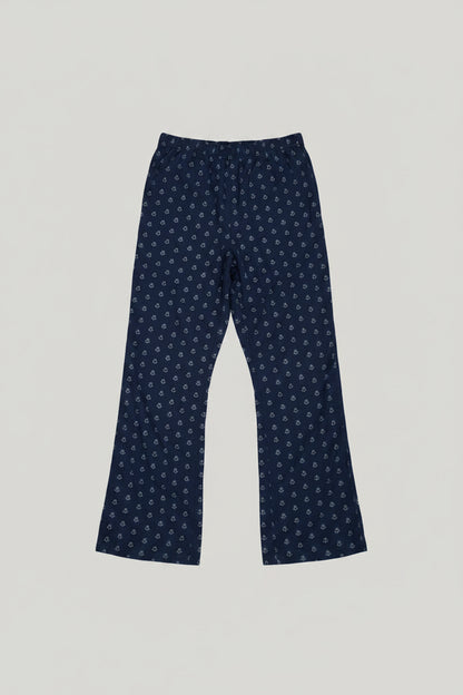 Blue patterned pants on a gray carpet