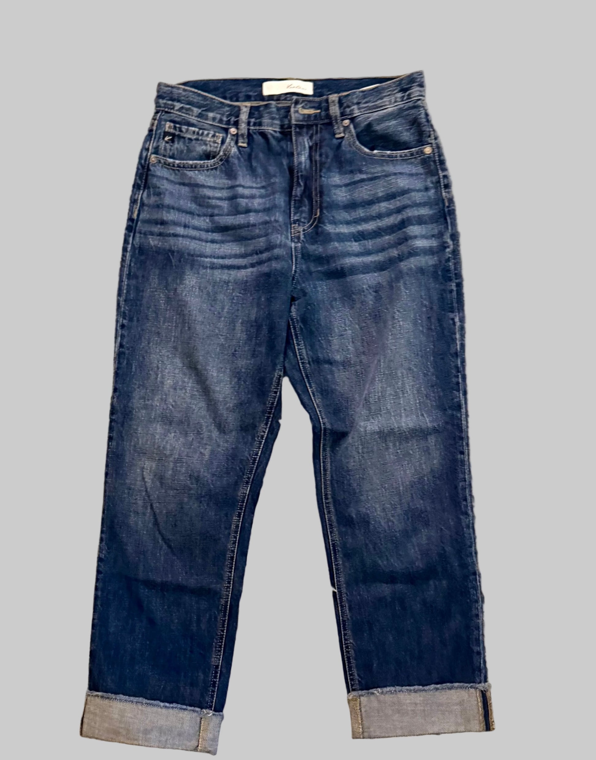 Pair of blue jeans on a gray background