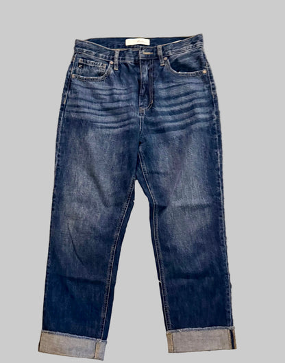 Pair of blue jeans on a gray background