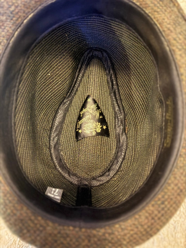 Close-up of the inside of a hat with a brand label.