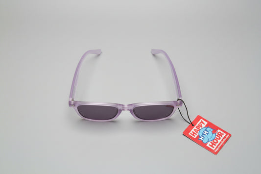 Purple eyeglasses on a gray surface with a 'Happy Hour' tag attached.